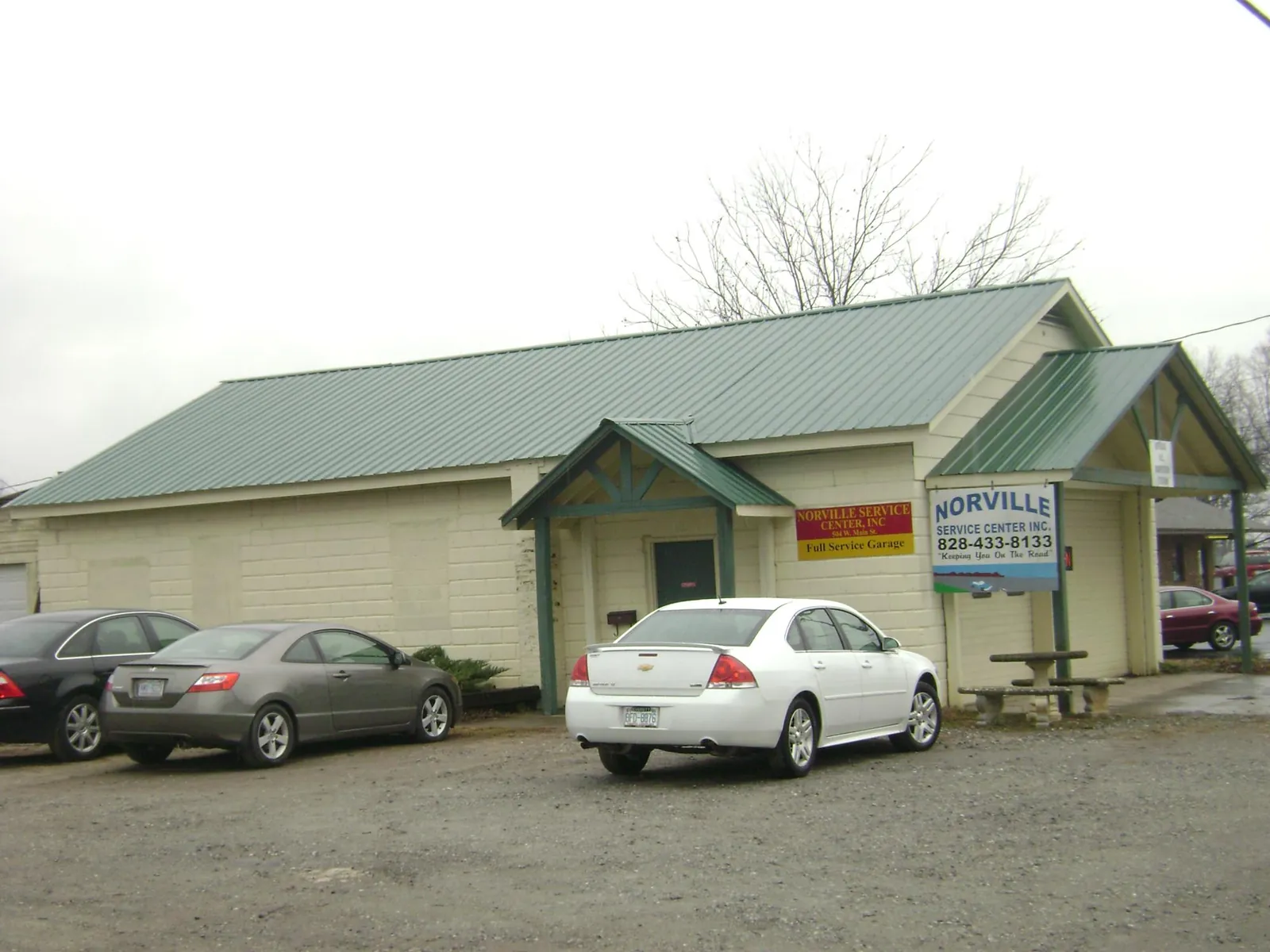 Green metal roof on a service garage with a covered entry in Dagsboro